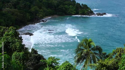 The beautiful Laem Sing Beach was taken from a viewpoint on a sunny, rainy day, with shadows of clouds running around, Phuket, Thailand