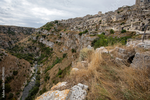 Fotografie View of Gravina river canyon and park of the Rupestrian Churches of Matera with