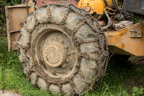 Chain on the wheels of a skidder, i.e. a tractor for skidding wood in difficult mountain terrain and with earthen ground