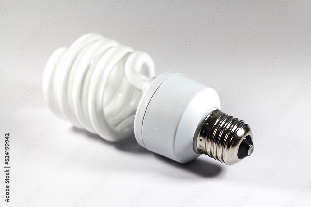 Glowing spiral light bulb isolated on white background. Eco energy saving light bulb concept Glowing spiral light bulb isolated on white background. Eco energy saving light bulb concept