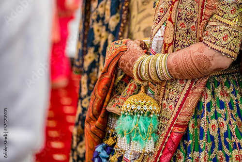 Indian Punjabi Sikh bride's wedding bangles and kalire close up © Stella Kou