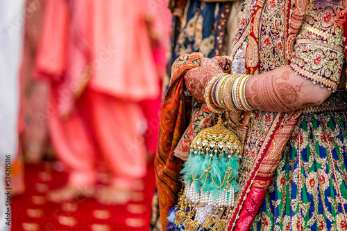 Indian Punjabi Sikh bride's wedding bangles and kalire close up © Stella Kou