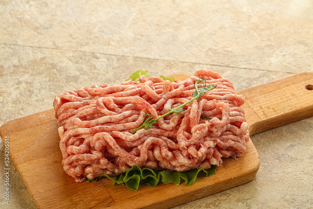 Raw minced pork meat over board Raw minced pork meat over board