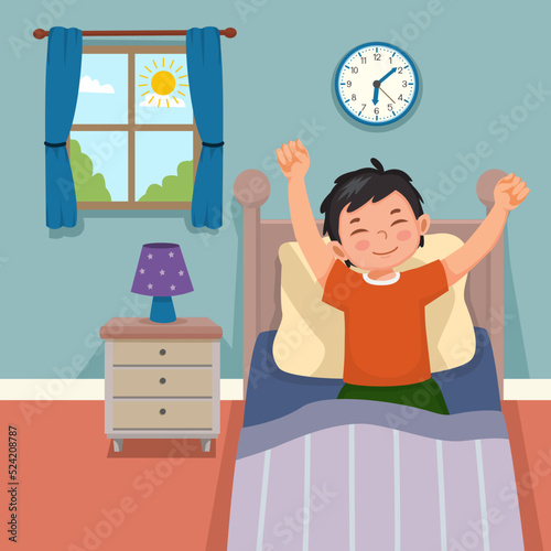Cute little boy wake up in morning stretching hands on bed in bedroom