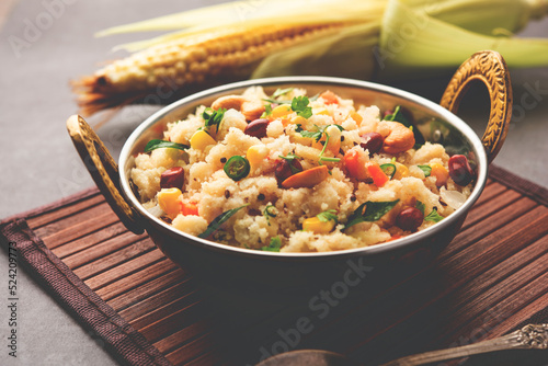 Sweet Corn Upma, makai rava uppittu made using with or without semolina , healthy Indian breakfast photo