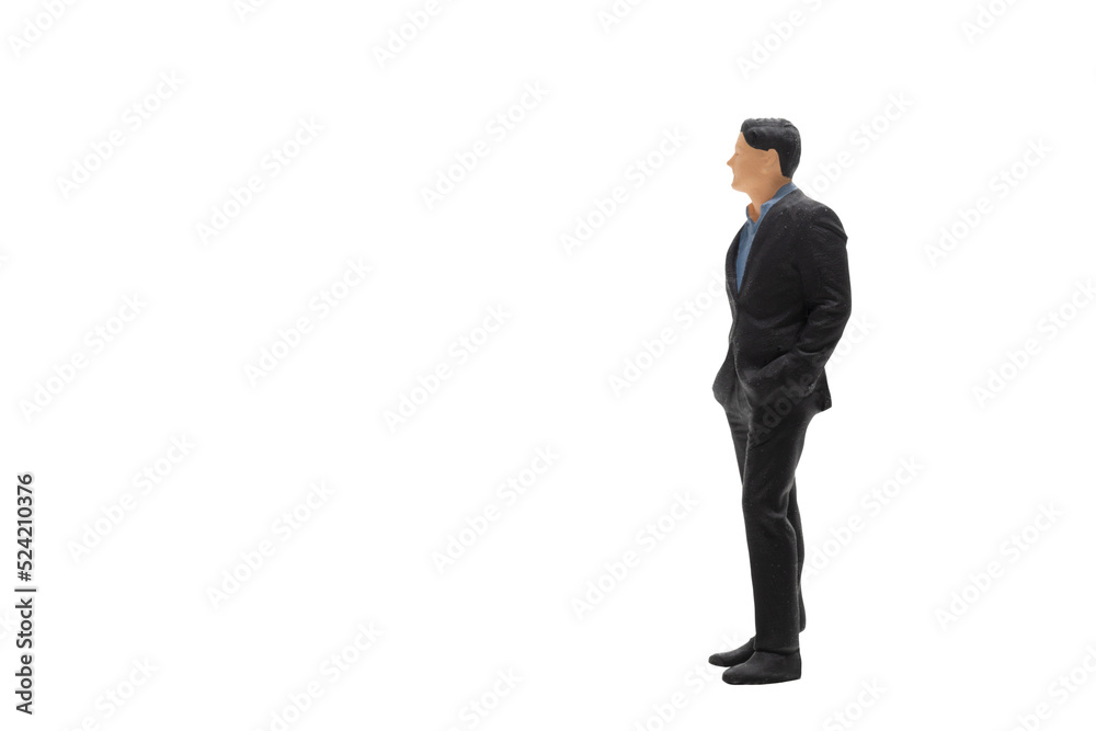 Miniature people businessman wearing black suit standing isolated on white background with clipping path Miniature people businessman wearing black suit standing isolated on white background with clipping path