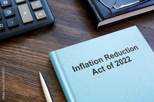 Fototapete Book with The Inflation Reduction Act of 2022 near calculator and notebook