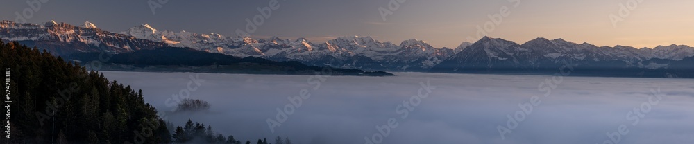 Panorama swiss alps with a sea of fog