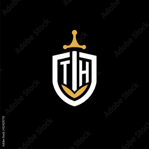 Creative letter TH logo gaming esport with shield and sword design ideas