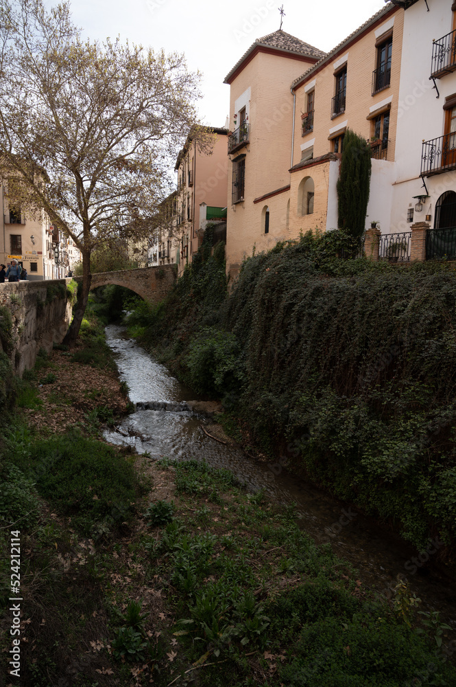 Walking in old central part of world heritage city Granada, Andalusia, Spain