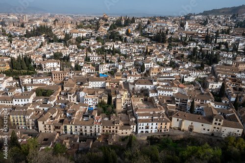 Aerial panoramic view on buildings, old district, mountains and palace, world heritage city Granada, Andalusia, Spain © barmalini