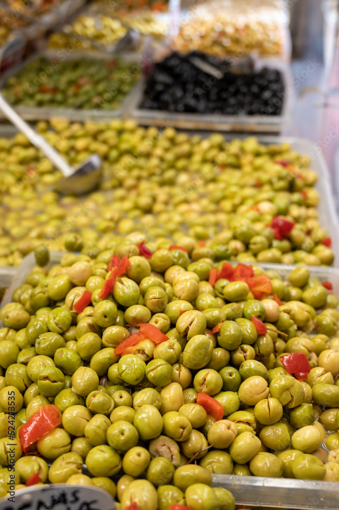 Assortment of pickled green olives on farmers market in Malaga, Andalusia, Spain
