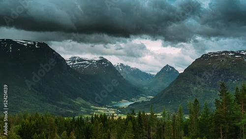 Byrkjelo Village, Sogn Og Fjordane County, Norway. Beautiful Sky Above Norwegian Rural Landscape. Bergheimsvatnet Lake In Summer Day. Agricultural And Weather Forecast Concept. Time-lapse 4k. photo