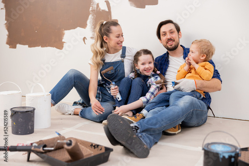 Canvas Print family dressed in denim style sitting on the floor