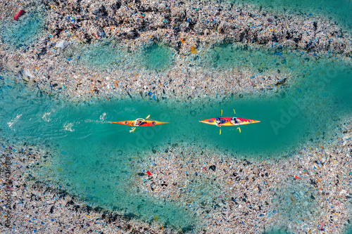 Aerial top view Kayak boat turquoise blue water sea. Concept pollution garbage plastic ocean