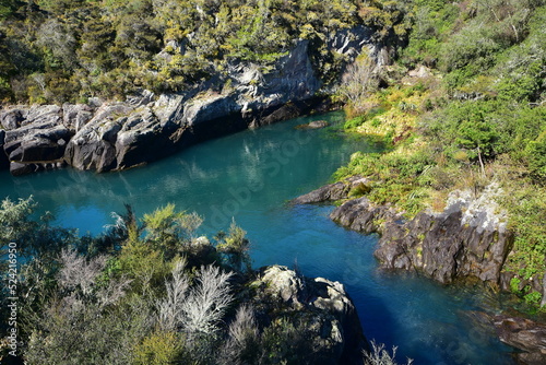 Calm turquoise waters of Waikato River near Aratiatia Rapids during period of closed spill gates. Location: Taupo New Zealand