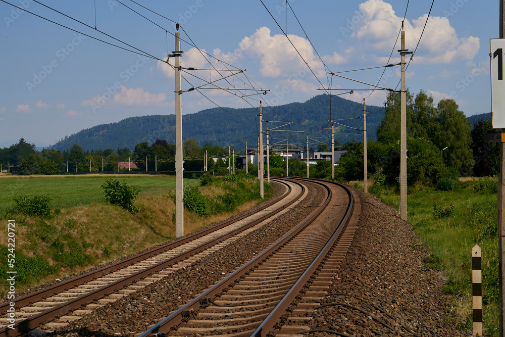 Landscape with railroad, blue sky in summer. Transportation