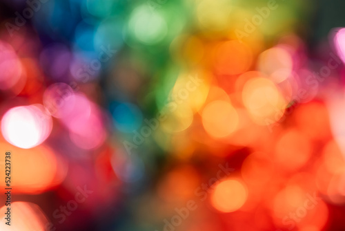 Blurred bokeh background for Christmas and New Year holiday. Abstract colorful wallpaper with defocused lights. Copy space © Lyubov
