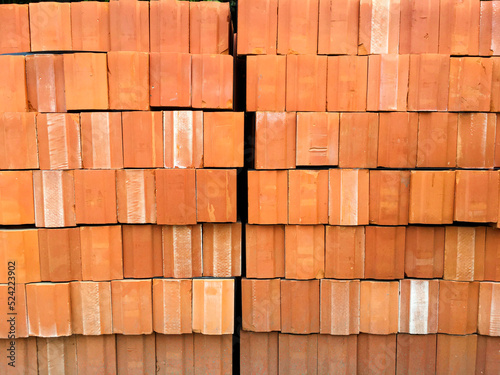 stack of orange bricks background. side of bricks