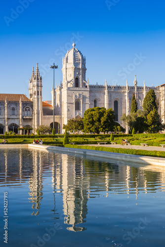 Towers of the Jeronimos monastery with reflection in the pond in Belem, Lisbon, Portugal
