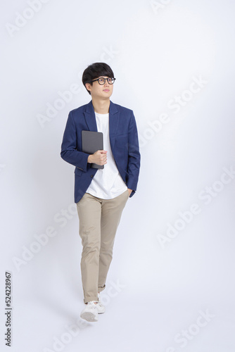 Confident business man or entrepreneur with tablet computer smile and go to see partners for future project on white studio  background