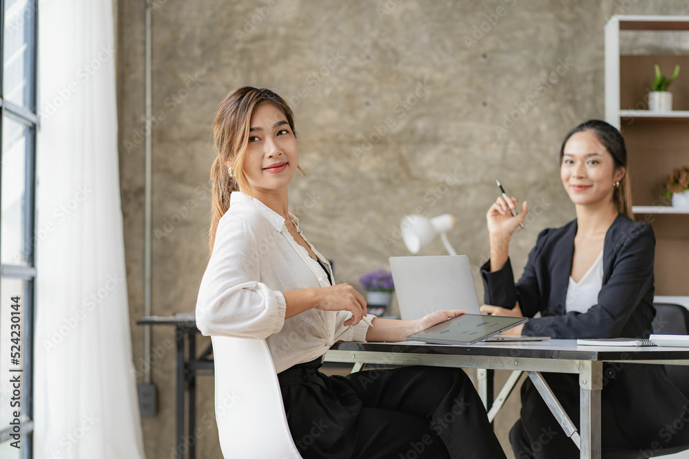 Asian business woman Use a laptop computer and work with the calculator documents on the desk. plan to analyze financial reports Invest in an office business plan Asian business woman Use a laptop computer and work with the calculator documents on the desk. plan to analyze financial reports Invest in an office business plan