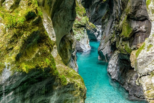 Breathtaking view of a turquoise stream in rocky Tolmin gorge in Slovenia photo