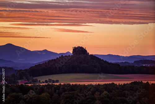 Sunrise at sächsische Schweiz near Bad Schandau with view on rock Zirkelstein.