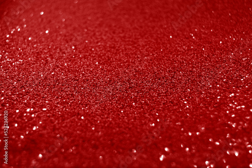 Red de focused sparkle glitter background 
