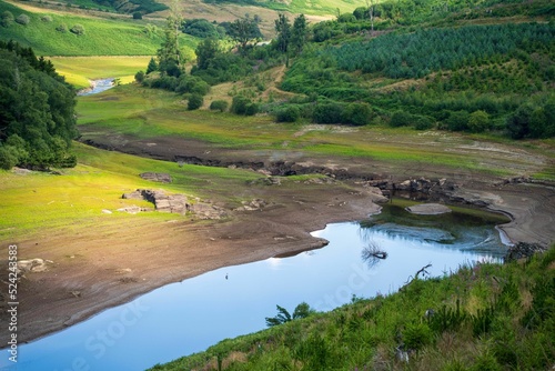 Low water levels due to drought conditions at at Llyn Brianne reservoir, Wales, UK photo