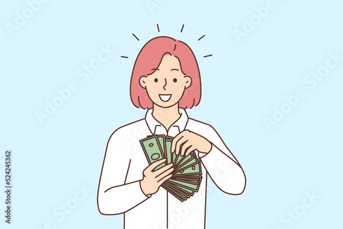 Smiling woman with money in hands 