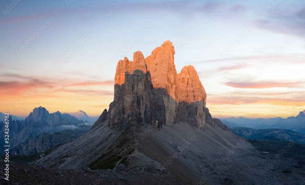 Stunning view of the Three Peaks of Lavaredo, (Tre cime di Lavaredo) during a beautiful sunrise. The Three Peaks of Lavaredo are the undisputed symbol of the Dolomites, Italy