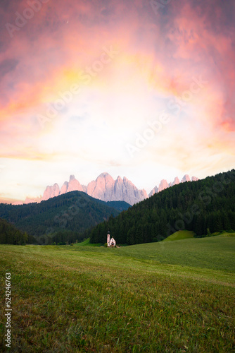 Stunning view of the Church of St. John (San Giovanni in Ranui ) that stands out in the green meadows, in the heart of the beautiful Dolomitic mountain landscape