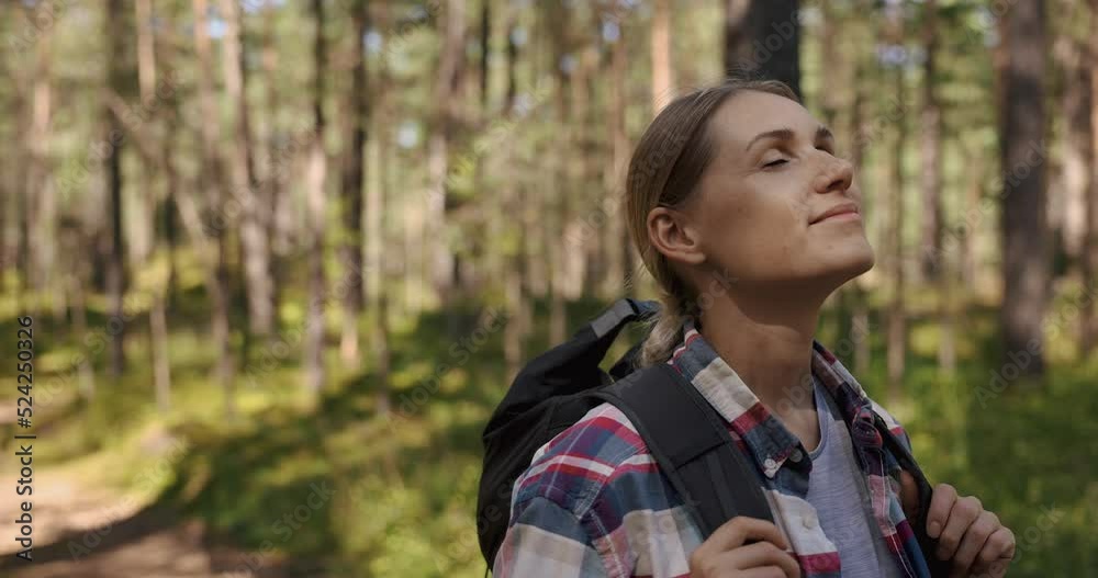 woman hiker enjoy the nature in forest with eyes closed. outdoor relaxing. stress relief, mental health woman hiker enjoy the nature in forest with eyes closed. outdoor relaxing. stress relief, mental health