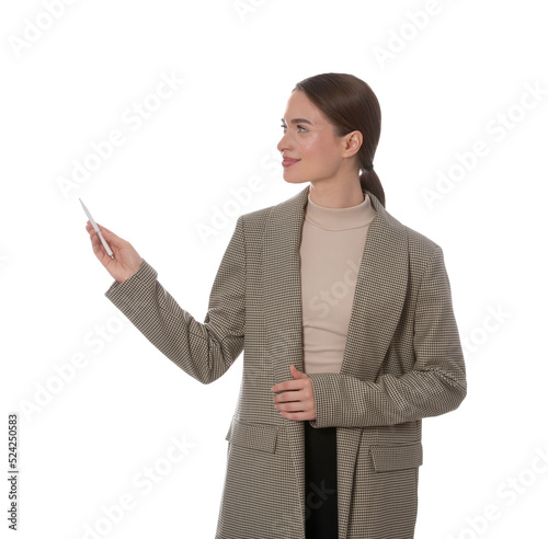 Beautiful woman pointing at something with pen on white background. Weather forecast reporter photo