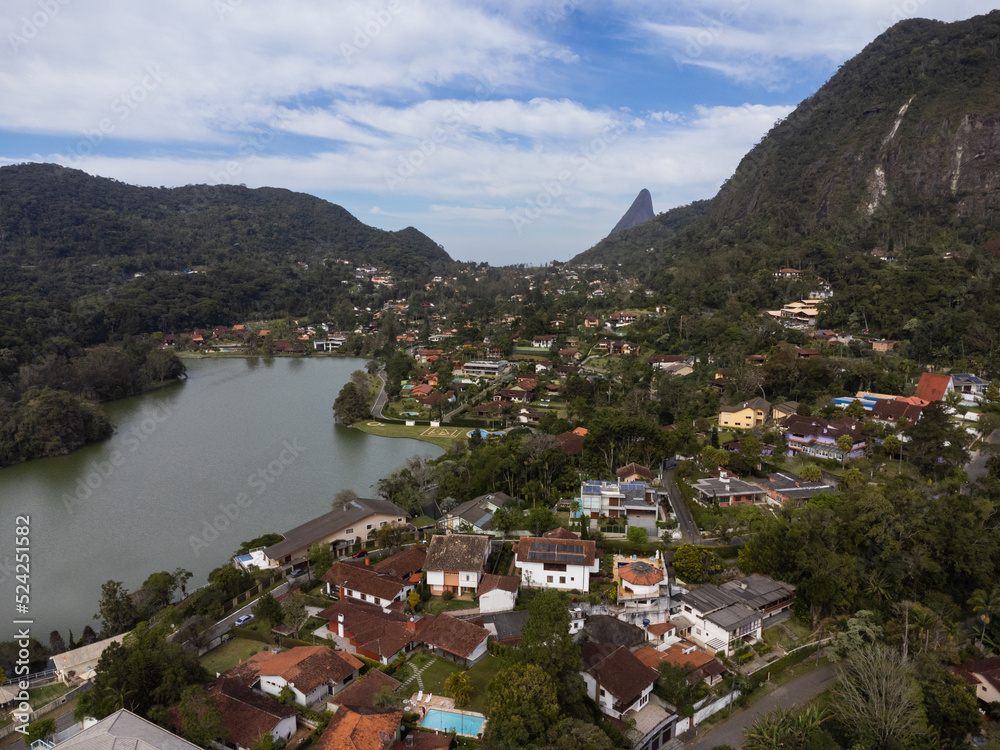 Aerial view of Granja Comary, Carlos Guinle neighborhood in the city of Teresópolis. Mountain region of Rio de Janeiro, Brazil. Drone photo. Houses, lake and hills and mountains