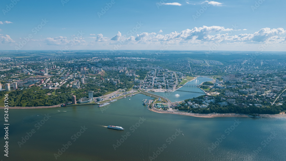 Scenic aerial view of Cheboksary, capital city of Chuvashia, Russia and a port on the Volga River on sunny summer day.