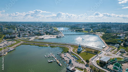 Fototapeta Naklejka Na Ścianę i Meble -  Scenic aerial view of Cheboksary, capital city of Chuvashia, Russia and a port on the Volga River on sunny summer day.