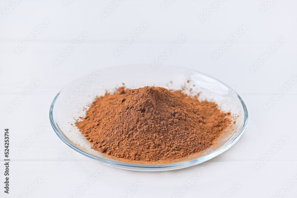 glass plate flour cocoa. white table. glass plate flour cocoa. white table.