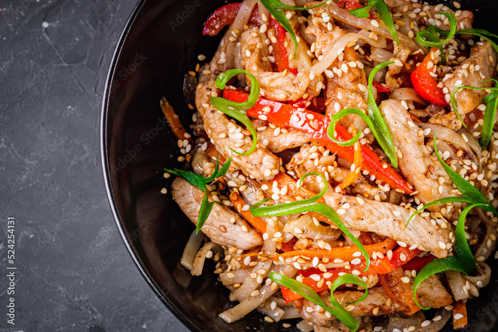 delicious chinese fried noodles on a black background
