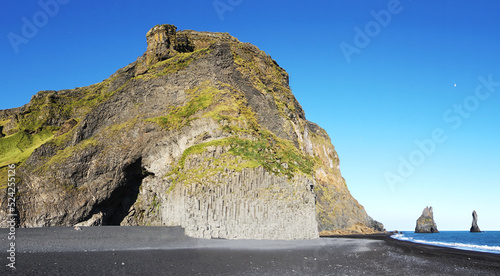 Basalt rocks and cave at Reynisfjara Black Beach in Iceland