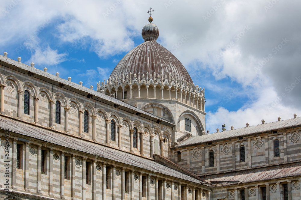 Facade and dome of medieval Pisa Cathedral in the Piazza del Duomo, next to Leaning Tower of Pisa and Pisa Baptistery of St. John, Pisa, ItalyHeritage Site
