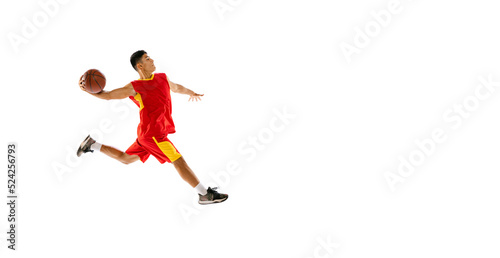 Portrait of young man, basketball player throwing ball into basket in a run isolated over white studio background. Flyer © Lustre