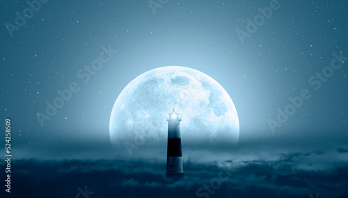 Fototapeta Naklejka Na Ścianę i Meble -  Night sky with super full moon in the clouds, on the foreground lighthouse 
