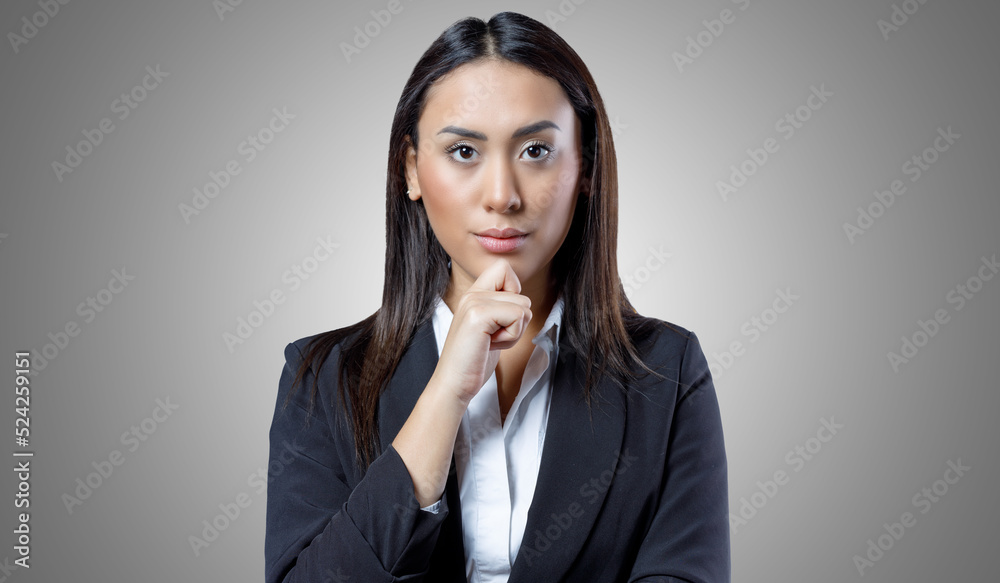 Portrait of confident young female worker isolated on grey background. Portrait of confident young female worker isolated on grey background.