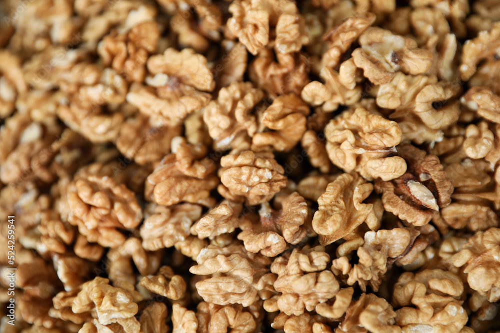Heap of delicious walnuts as background, closeup view Heap of delicious walnuts as background, closeup view