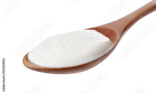 Wooden spoon with delicious organic yogurt isolated on white
