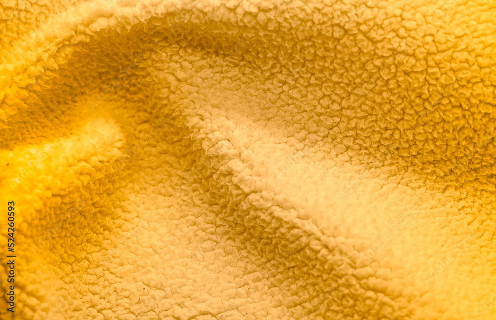 Bright  yellow soft wool textures background. Detail of sheep fur.