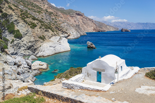 Whitewashed chapel at Agia Anna beach on Amorgos Island in Greece. photo