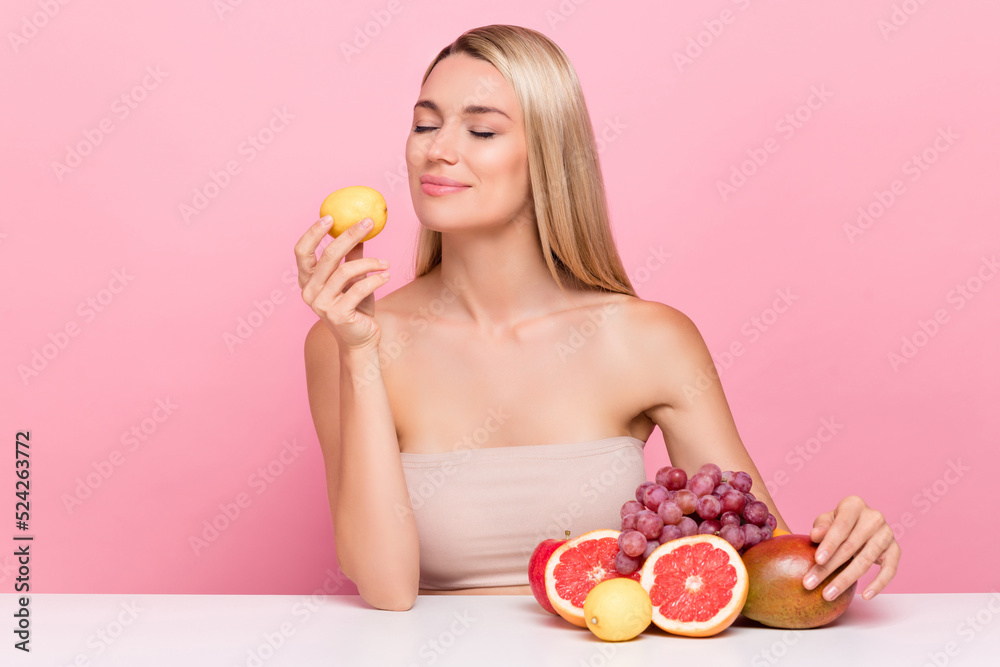 Photo of happy lady smell citrus fresh skin hydrated vitamins rejuvenation concept isolated over pink pastel color background